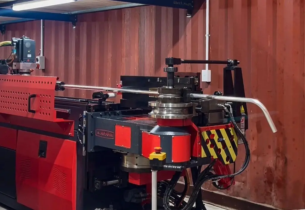 Bending head of Probend's Akyapak ABM 50 CNC3 in the Invercargill workshop, with a freshly bent tube